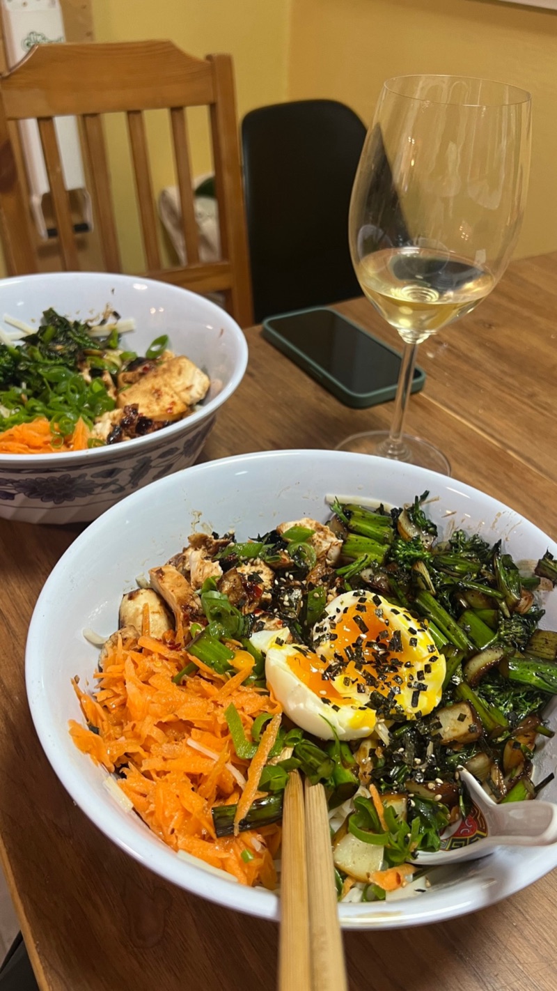 Chicken ramen bowl with jammy egg, broccolini, and carrots