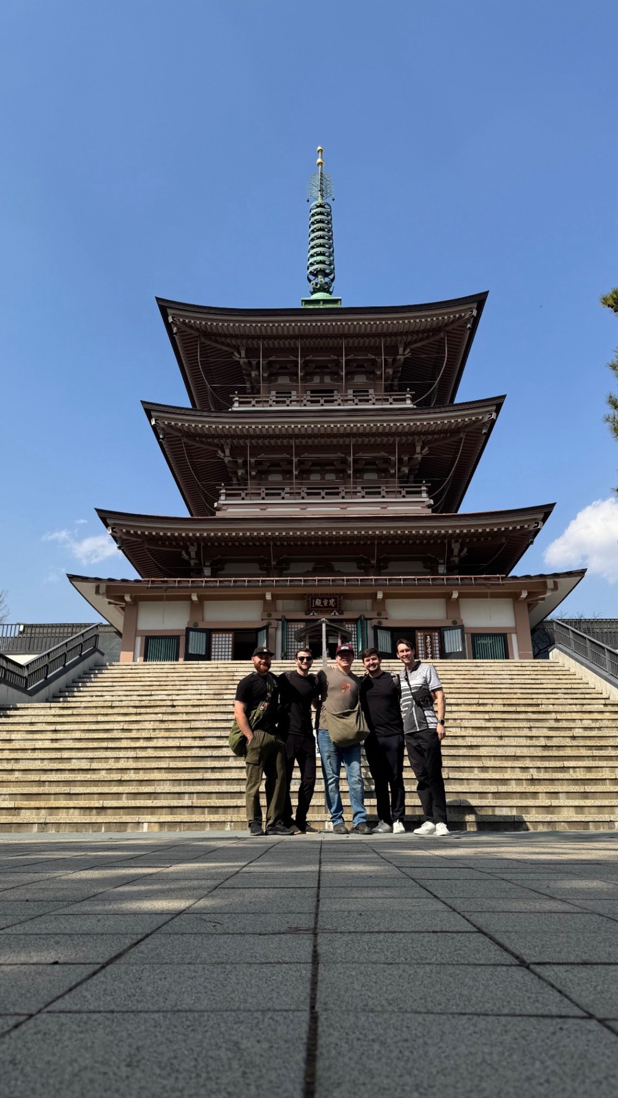 With college friends in front of a pagoda in Japan