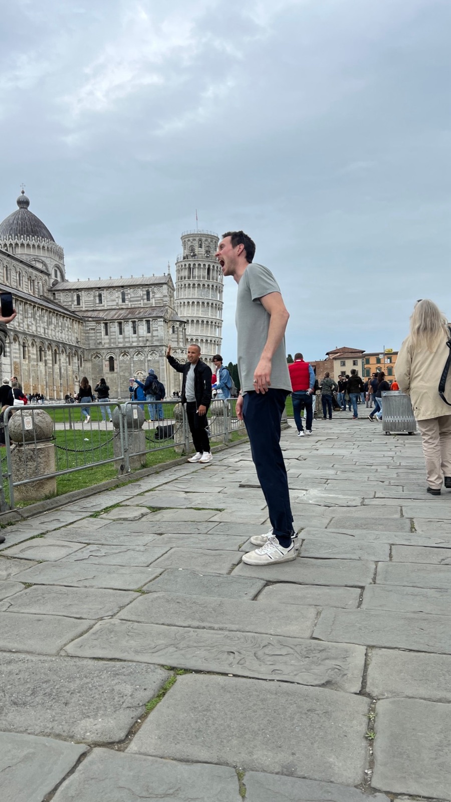 Pretending to bite the Leaning Tower of Pisa