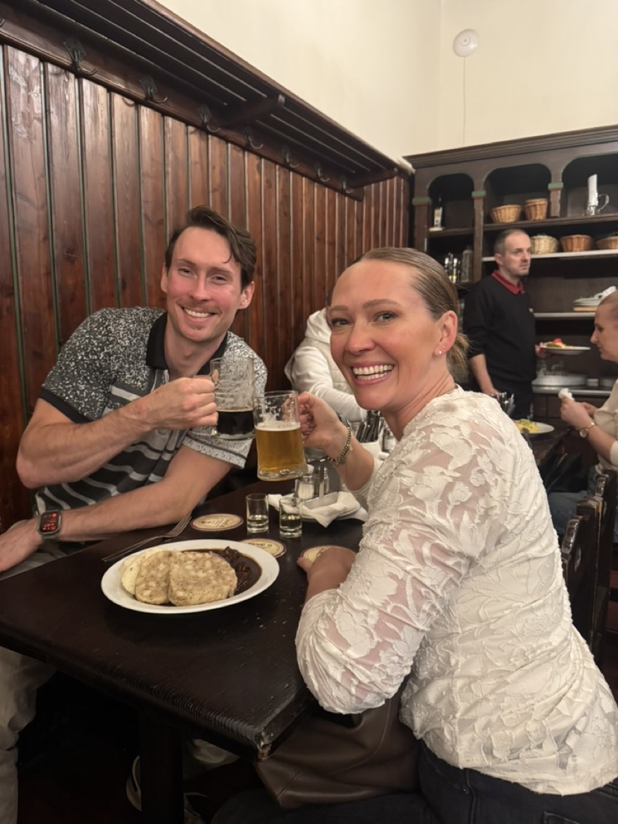 Toasting beers with my sister in a Czech pub